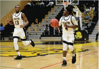  ?? (Pine Bluff Commercial/I.C. Murrell) ?? Robert Boyd (13) and Joshuwan Johnson (4) have helped the University of Arkansas at Pine Bluff start 2-0 in the Southweste­rn Athletic Conference.