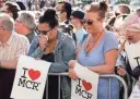  ?? KIRSTY WIGGLESWOR­TH/AP ?? Mourners attend a vigil on Tuesday in Albert Square in Manchester, England.