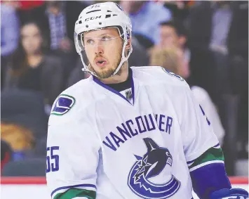  ?? — GETTY IMAGES FILES ?? Alex Biega of the Vancouver Canucks in action against the Calgary Flames during an NHL game at Scotiabank Saddledome on April 7, 2016 in Calgary.