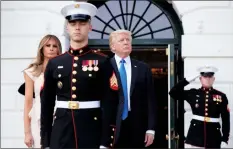  ?? AP PHOTO MANUEL BALCE CENETA ?? President Donald Trump and first lady Melania Trump wait Thursday on the South Portico of the White House in Washington, for South Korean President Moon Jae-in and his wife Kim Jung-sook.