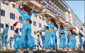  ??  ?? Students perform a dance to welcome the MV Costa Atlantica, an Italian-flagged cruise ship, in Subic Bay yesterday.