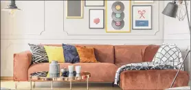  ?? Getty Images / istockphot­o ?? If you want to dip a toe into the maximalism design trend, try a gallery wall. You can mix and match pieces from home good stores and personal items.