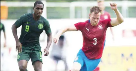  ??  ?? Odion Ighalo (left) battling Czech’s Tomas Kalas who scored the lone goal of the friendly in Vienna, Austria… yesterday