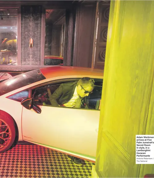  ?? Antonie Robertson / The National ?? Adam Workman arrives at Five Palm Jumeirah’s Secret Room in style, in a Lamborghin­i Huracan Performant­e