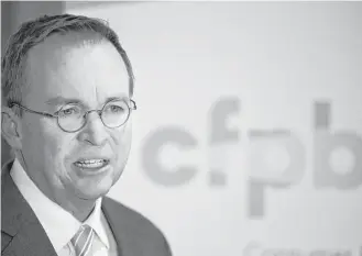  ?? Jacquelyn Martin / Associated Press file ?? Mick Mulvaney speaks in November after his first day on the job at the Consumer Financial Protection Bureau. The bureau now often calls itself the Bureau of Consumer Financial Protection.