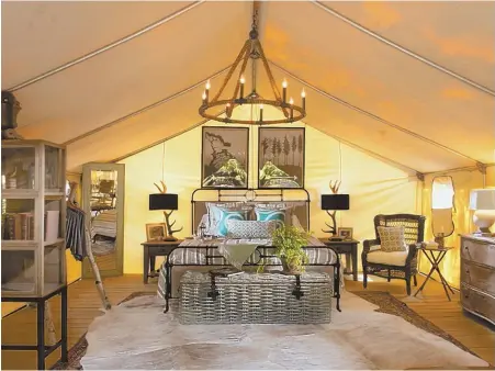  ??  ?? CAMPING IN STYLE: A ‘glamp’ tent at Sandy Pines Campground in Kennebunkp­ort, Maine, above, offers the amenities of a luxe hotel in a more secluded locale.