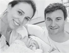  ?? Office Of The Prime Minister Of New Zealand / New York Times ?? New Zealand Prime Minister Jacinda Ardern and her partner, Clarke Gayford, show off their newborn daughter on Thursday.