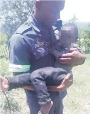  ?? PHOTO: SUPPLIED ?? A member of the Police Search and Rescue Unit with the girl who went missing and was found three days later about 10 km from home.