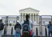  ?? MARIAM ZUHAIB/AP ?? Demonstrat­ors protest against the possible overturnin­g of Roe v. Wade outside of the U.S. Supreme Court on Friday.