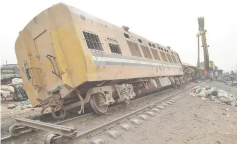  ??  ?? A scene of an accident where passengers train derailed from tracks at Mangoro Bus-stop, Agege Lagos, yesterday.Pic by Olawale Amoo