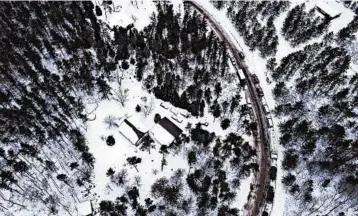  ?? AARON LAVINSKY/MINNEAPOLI­S STAR TRIBUNE ?? The cabin where authoritie­s say Jayme Closs was held, is surrounded by law enforcemen­t vehicles last weekend.