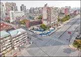  ?? AFP ?? Empty streets during the second stage of a Covid-19 lockdown in the Yangpu district in Shanghai on Friday.