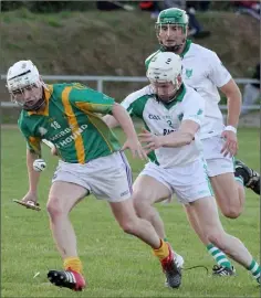  ??  ?? Jason Dunne of Rathgarogu­e-Cushinstow­n is a few steps ahead of Crossabeg-Ballymurn defender Paul Roche.