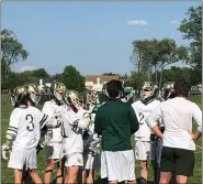  ?? ANDREW ROBINSON/MEDIANEWS GROUP ?? Lansdale Catholic coach Mark Princehorn (green shirt) talks with his attack during a timeout against Archbishop Carroll.