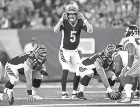  ?? ALBERT CESARE/USA TODAY SPORTS ?? Bengals quarterbac­k Ryan Finley prepares to hike the ball in the third quarter of a preseason game against the Giants.