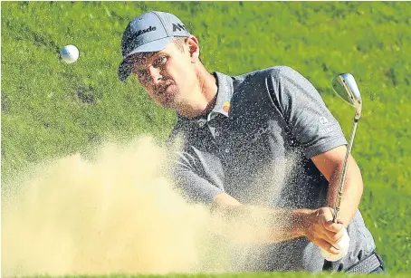  ?? Picture: Getty. ?? Justin Rose blasts out of a bunker on the third hole during yesterday’s pro-am at Wentworth.