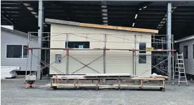  ??  ?? A prefabrica­ted house built in a factory in Huntly by BuildSmart is the first to be completed in a trial run by Westpac bank.