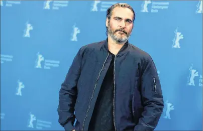  ?? AP PHOTO ?? Actor Joaquin Phoenix poses at a photo call for the film ‘Don’t Worry, He Won’t Get Far On Foot’, during the 68th edition of the Internatio­nal Film Festival Berlin, Berlinale, in Berlin, Germany, Tuesday, Feb. 20, 2018. Phoenix acts coy when asked...