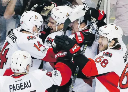  ?? — AP FILES ?? Ottawa Senators forward Alex Burrows, top left, knows first-hand how fleeting playoff success can be from his days with the Canucks and has been a voice of reason for his new team, which opened the second round Thursday against the Rangers, since being...