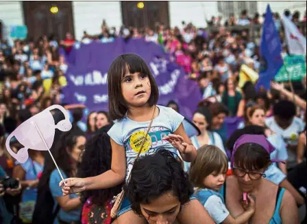  ??  ?? Mothers and daughters: Thousands of Brazilians protesting against a controvers­ial Bill which aims to cut the right to abortion in Rio de Janeiro, Brazil. — AFP