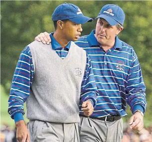  ?? TIMOTHY A. CLARY AFP VIA GETTY IMAGES FILE PHOTO ?? Neither Tiger Woods, left, nor Phil Mickelson will be competing at this year’s Ryder Cup at Whistling Straits — and that may be a good thing for Team USA, says columnist Tim Dahlberg.