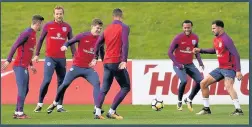  ??  ?? FULL OF CONFIDENCE Stones works hard during England training yesterday