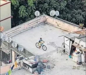  ?? KUNAL PATIL / HT ?? MUMBAI (left): “Kids aren’t allowed to play in the compound; it’s reserved for parking,” says Ashwini Dandwate, 40, who lives with daughters aged 14 and 7 in metropolit­an Mumbai. “There is a podium area, but it’s tiled, so they could slip and hurt...