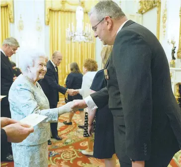  ??  ?? Paul James meets Queen Elizabeth after receiveing the life saving Certificat­e of Merit.