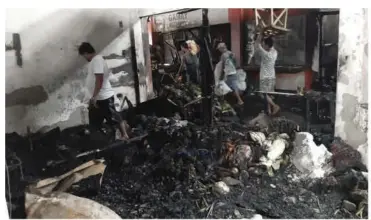  ?? BFP-MANAPLA ?? THE debris of the fire that left an estimated damage of P58 million worth of properties inside the public market of Manapla town in Negros Occidental early Friday.