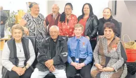  ??  ?? George Burt and wife Mabel Wharekawa-Burt surrounded by close friends at the celebratio­n dinner.