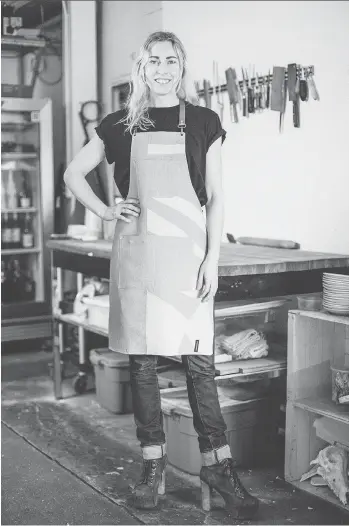  ?? ERIN CROOKS ?? Chef Christie Peters models an apron designed by Laurie Brown for the Prairie Grid Dinner Series, which stops in Saskatoon on Oct. 3.