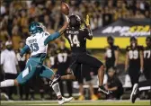  ?? MATT KELLEY — THE ASSOCIATED PRESS ?? Coastal Carolina safety Mateo Sudipo deflects a pass intended for Appalachia­n State wide receiver Malik Williams during the first half on Wednesday.