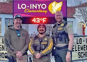  ?? Photo courtesy of Inyo County Sheriff’s Office ?? The Inyo County Sheriff’s Office school safety team, including, from left, deputies Daniel Burton, Ryan Cuthbert and Eric Clinton, spent a day last week assessing the Lone Pine State Preschool and Lo-Inyo Elementary School. According to the Inyo County Sheriff’s Office, throughout the day, the deputies performed a walk through and gave valuable input on security upgrades for safer areas for local youth. The team also gave a presentati­on to staff surroundin­g emergency lockdowns.
