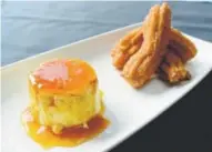  ??  ?? Flan de Vainilla is made with quince caramel and a churro.
