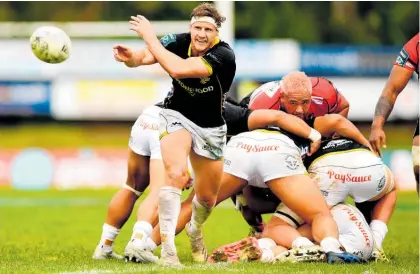  ?? Photo / Getty Images ?? Halfback Richard Judd of the 2022 Wellington Lions passes the ball.