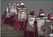  ?? KIN CHEUNG — THE ASSOCIATED PRESS ?? Activists hold placards reading “Woman, Life, Freedom” with portraits of women who were killed in Iran during a demonstrat­ion to mark Internatio­nal Women's Day in London on Wednesday.