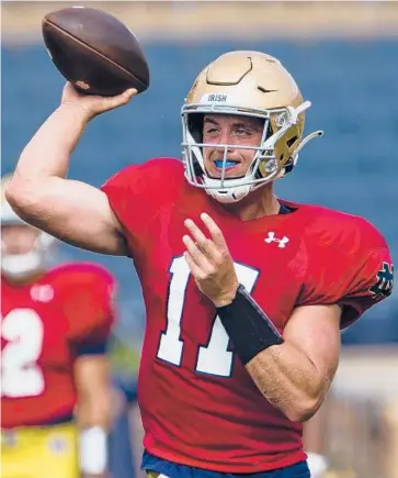  ?? MICHAEL CATERINA/SOUTH BEND TRIBUNE ?? QB Jack Coan started 18 games for Wisconsin before transferri­ng to Notre Dame.