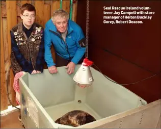  ??  ?? Seal Rescue Ireland volunteeer Jay Campell with store manager of Heiton Buckley Gorey, Robert Deacon.