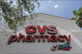  ?? ALAN DIAZ — THE ASSOCIATED PRESS FILE ?? ACVS pharmacy sign at a store in Hialeah, Fla., is shown. CVS will buy insurance giant Aetna in a roughly $69 billion deal that will help the drugstore chain provide more health care and keep a key client, according to a person with knowledge of the...