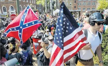  ?? Steve Helber Associated Press ?? THE ACLU defended the rights of white nationalis­t groups to protest in Charlottes­ville, Va., last weekend.
