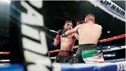  ??  ?? Blood streams from the face of Alex Saucedo, left, as he fights Lenny Zappavigna on June 30 in Oklahoma City.