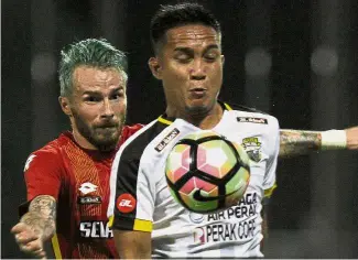  ??  ?? No let-up: Captain Mohd Shahrom Kalam (right) wants Perak to finish as high as possible in the Super League this season.