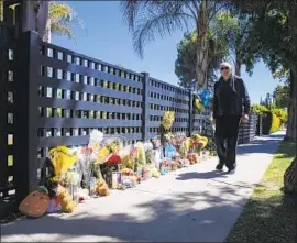  ?? Irfan Khan Los Angeles Times ?? A MEMORIAL in West Hills on Wednesday, for three children, Natalie Flores, 12; Kevin Yanez, 10; and Nathan Yanez, 8, who died over Mother’s Day weekend.