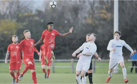  ??  ?? Washington (red) battle against Consett in last weekend’s 4-1 home defeat to the dominant Steelmen. Pictures by Tim Richardson.