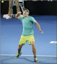  ?? THE ASSOCIATED PRESS ?? Alex De Minaur of Australia reacts after he won his match against Milos Raonic of Canada 6-4, 6-4, during the Brisbane Internatio­nal tennis tournament in Brisbane, Australia, Wednesday.