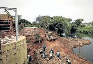  ?? /Sunday Times ?? Holding the line: A water treatment plant under repair. The Department of Water and Sanitation says it is encouraged by the number of water systems that have moved out of the critical risk category.