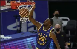  ?? JEFF CHIU — THE ASSOCIATED PRESS ?? Warriors forward Andrew Wiggins dunks against the Utah Jazz in San Francisco on Sunday.