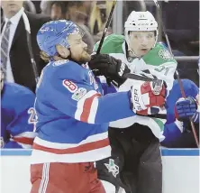  ?? AP PHOTO ?? CHECK IT OUT: The Rangers’ Kevin Klein (left) collides with the Stars’ Antoine Roussel during Dallas’ wild 7-6 victory last night in New York.