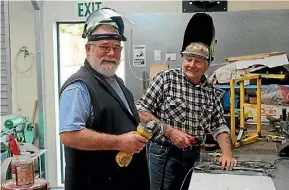  ?? PHOTO: ZIZI SPARKS/FAIRFAX NZ ?? Shed members in the new extension: engineers supervisor John Sutherland, left, and Gwynn Jones.