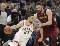  ?? TONY DEJAK — ASSOCIATED PRESS ?? The Raptors’ Fred VanVleet drives against Kevin Love during the second half March 21 at Quicken Loans Arena.